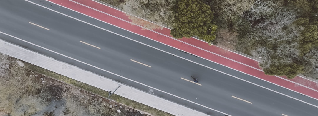 Group of road cyclists riding together outdoors on paved roads.