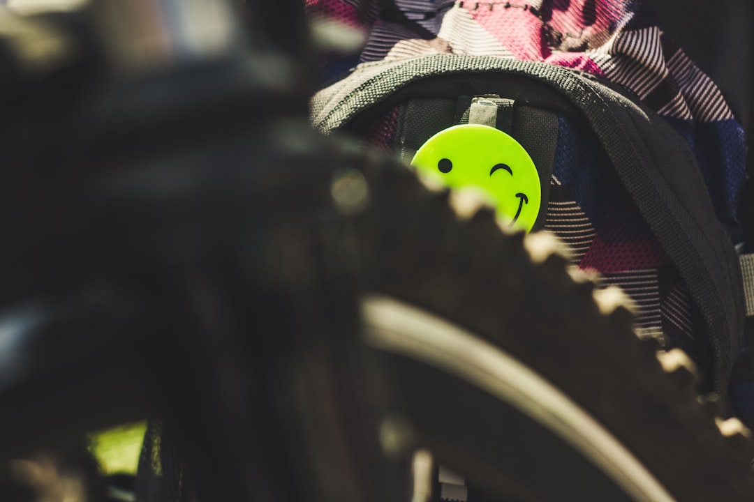 Close-up of a cyclist pedaling on a road bike with a power meter visible.