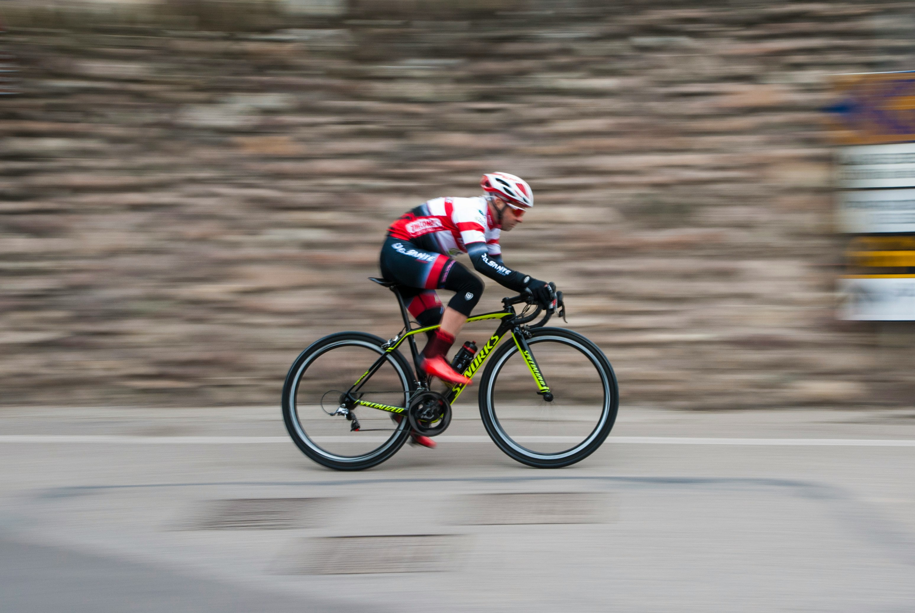 Cyclist riding a road bike outdoors in real conditions.