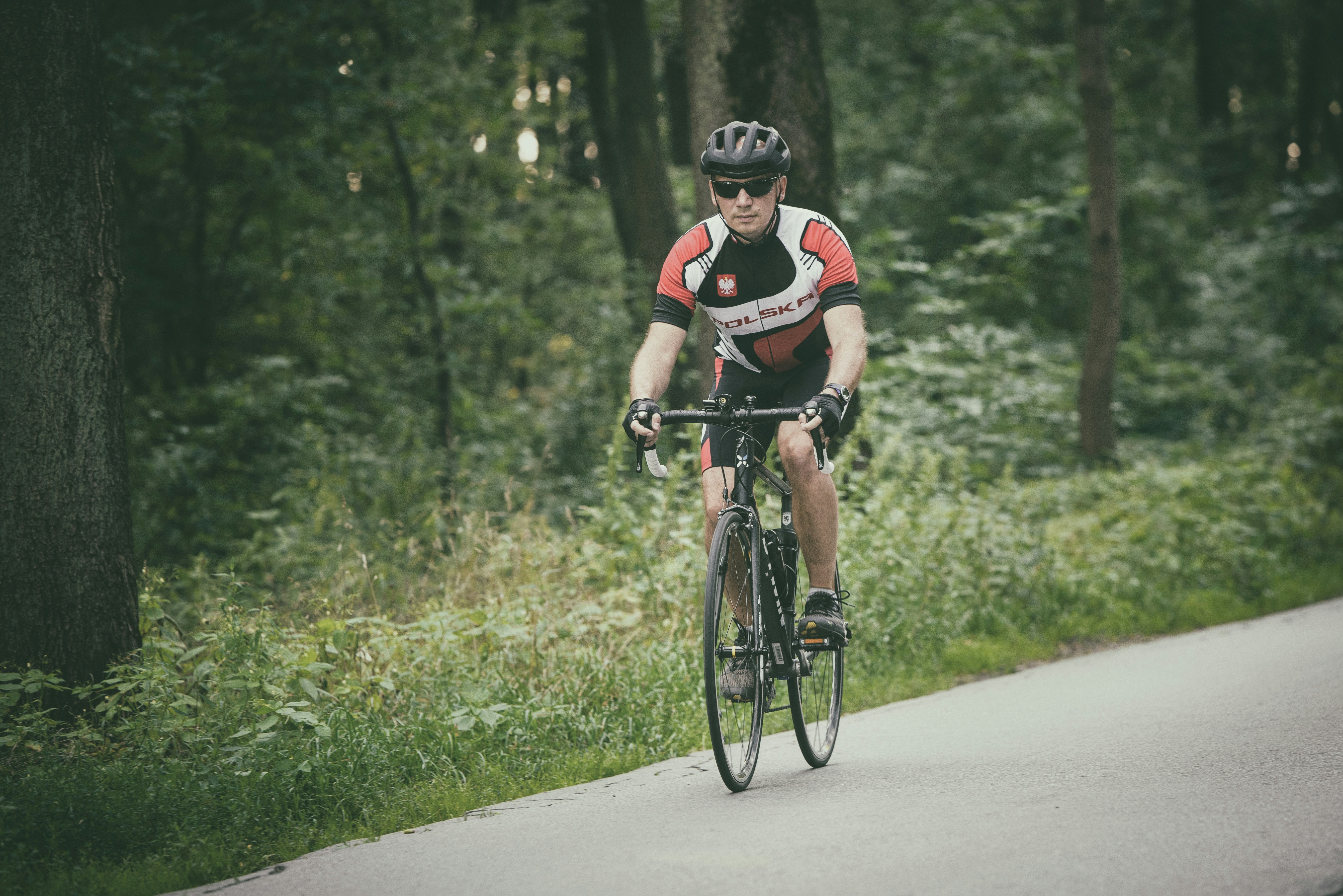 Cyclist riding a road bike outdoors in real conditions.