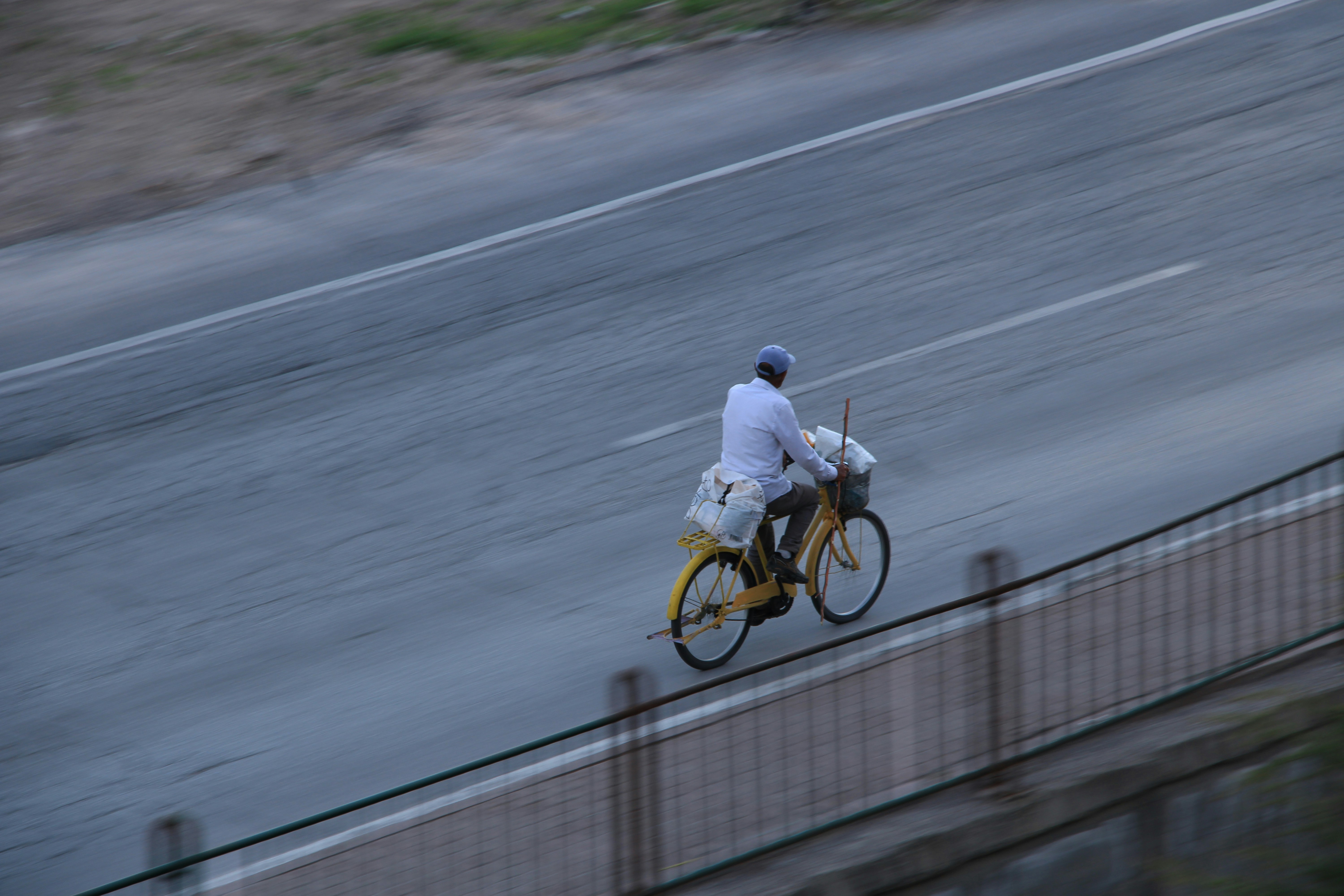 Cyclist riding a road bike outdoors in real conditions.