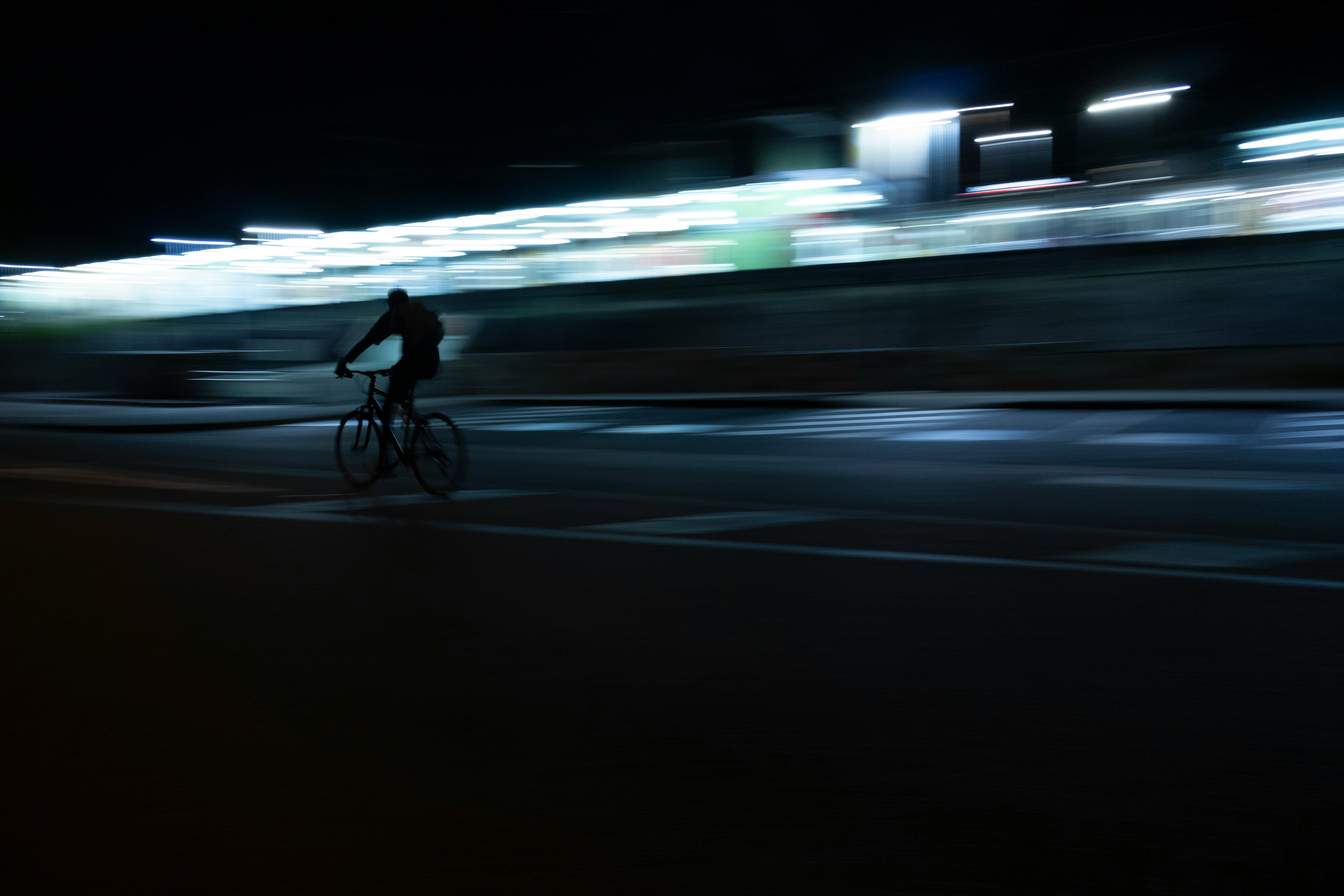 Cyclist riding a road bike outdoors in real conditions.