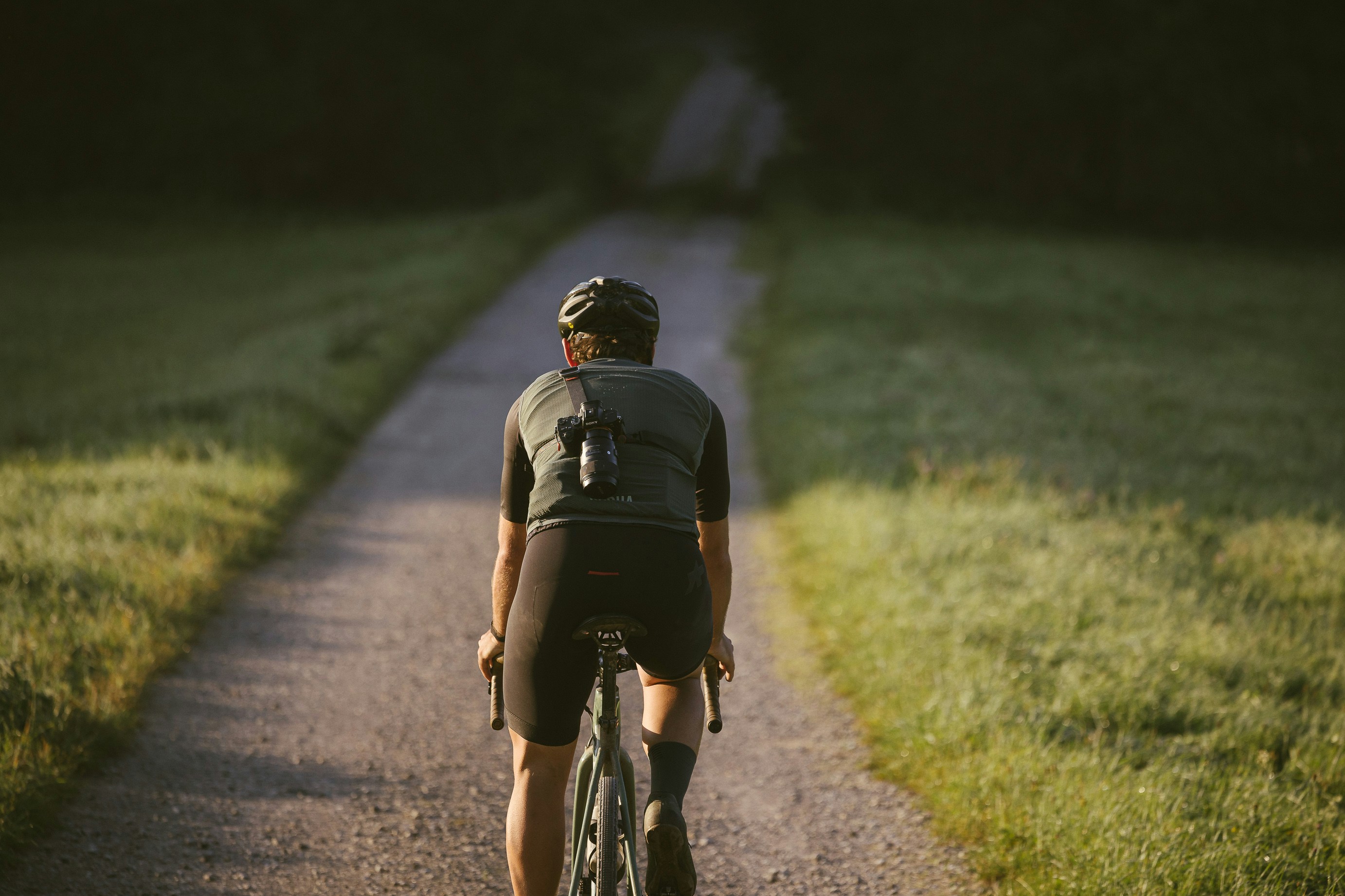 Cyclist riding a road bike outdoors in real conditions.