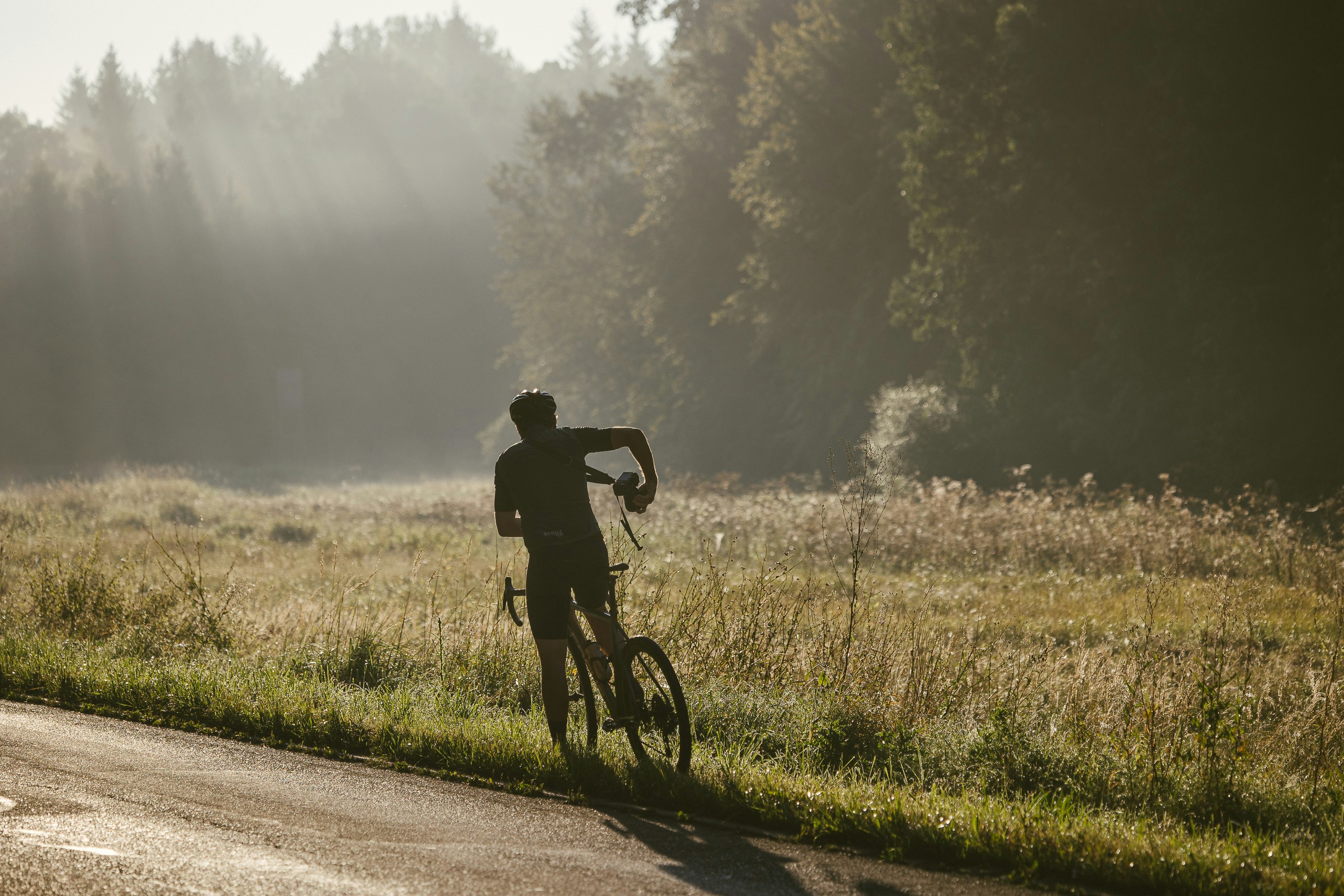 Cyclist riding a road bike outdoors in real conditions.
