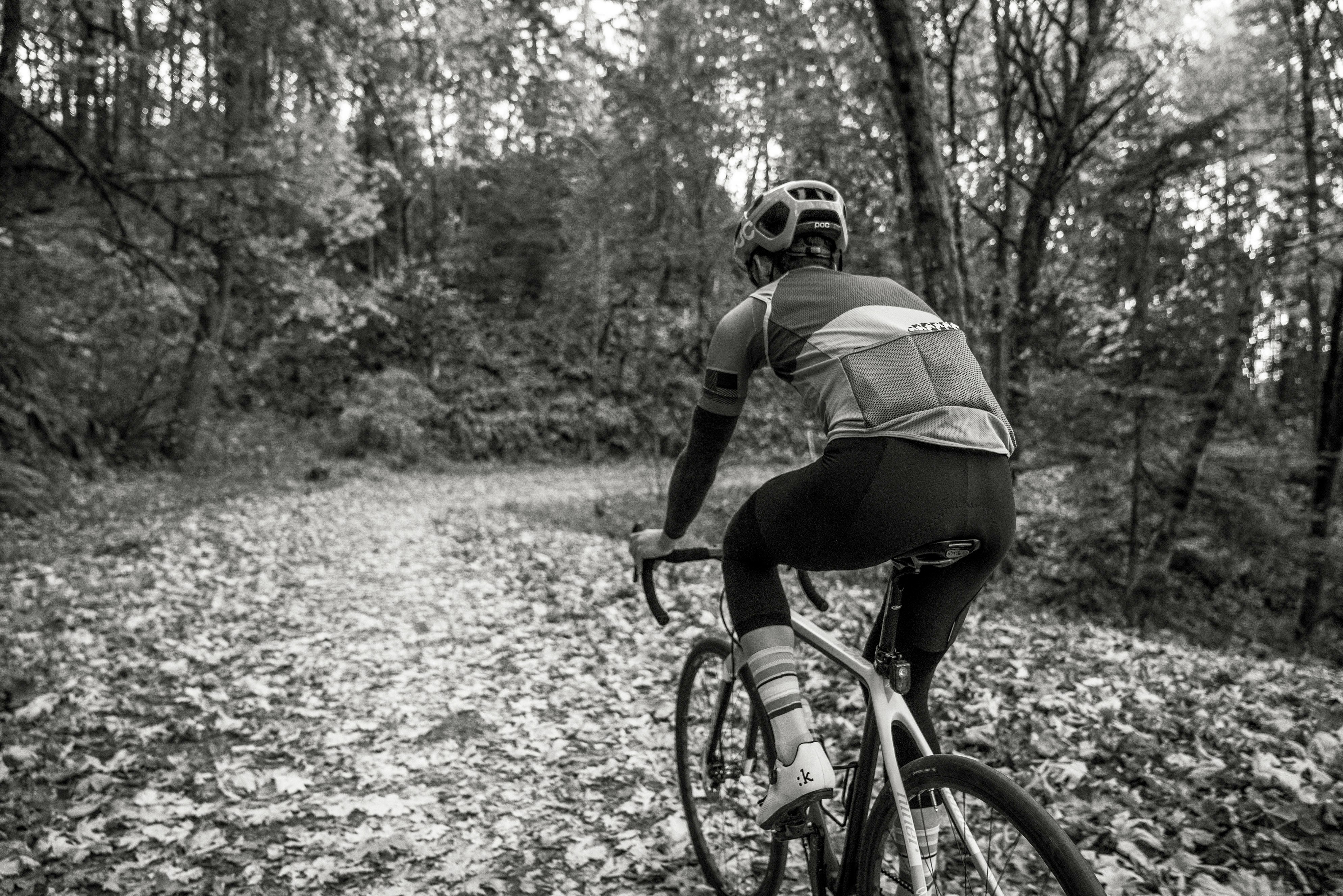 Cyclist riding a road bike outdoors in real conditions.