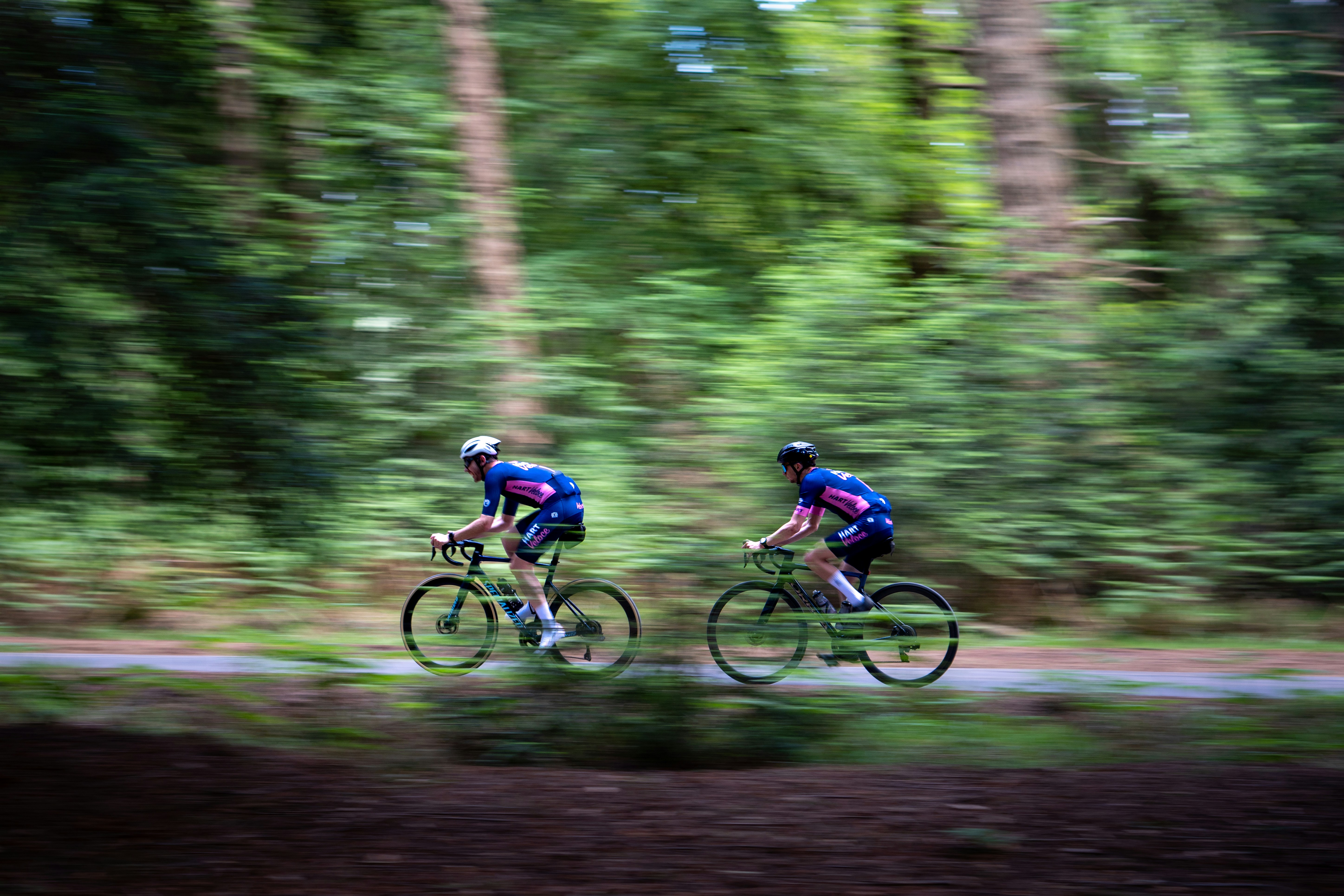 Cyclist riding a road bike outdoors in real conditions.