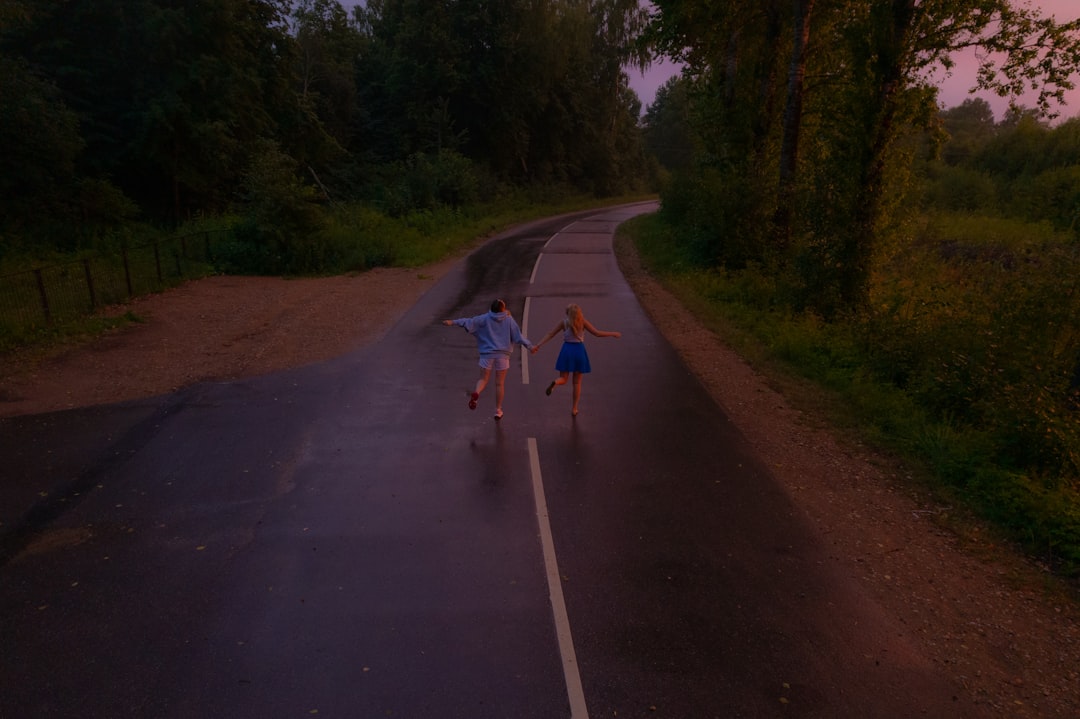 Group of road cyclists riding together outdoors on paved roads.