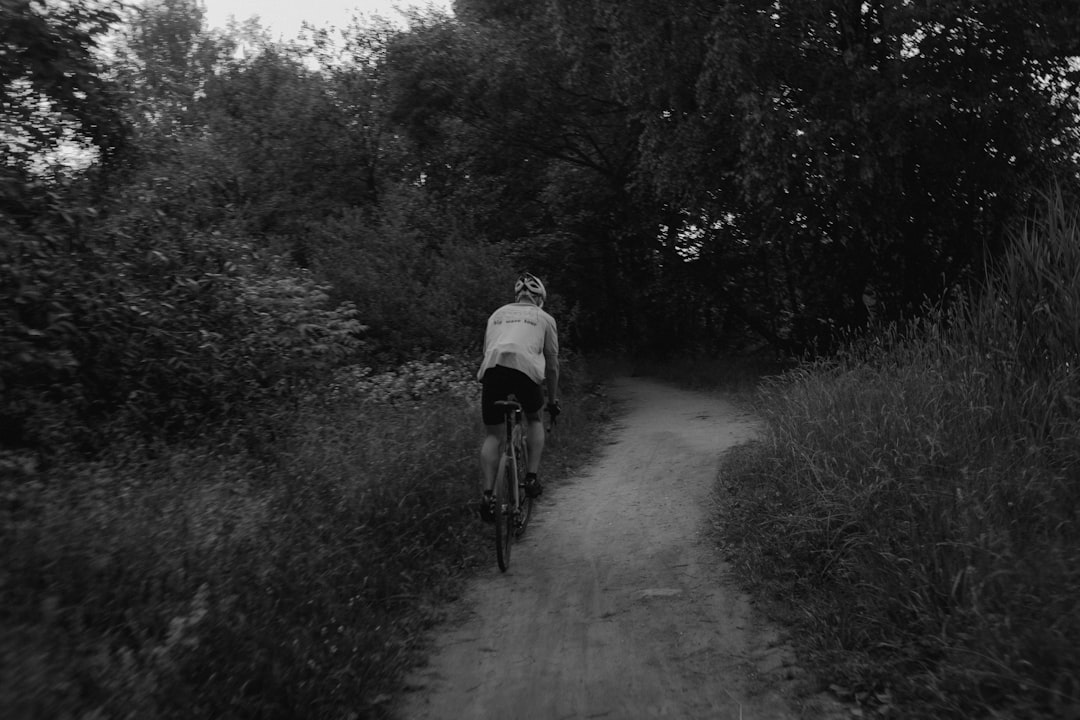 Group of road cyclists riding together outdoors on paved roads.