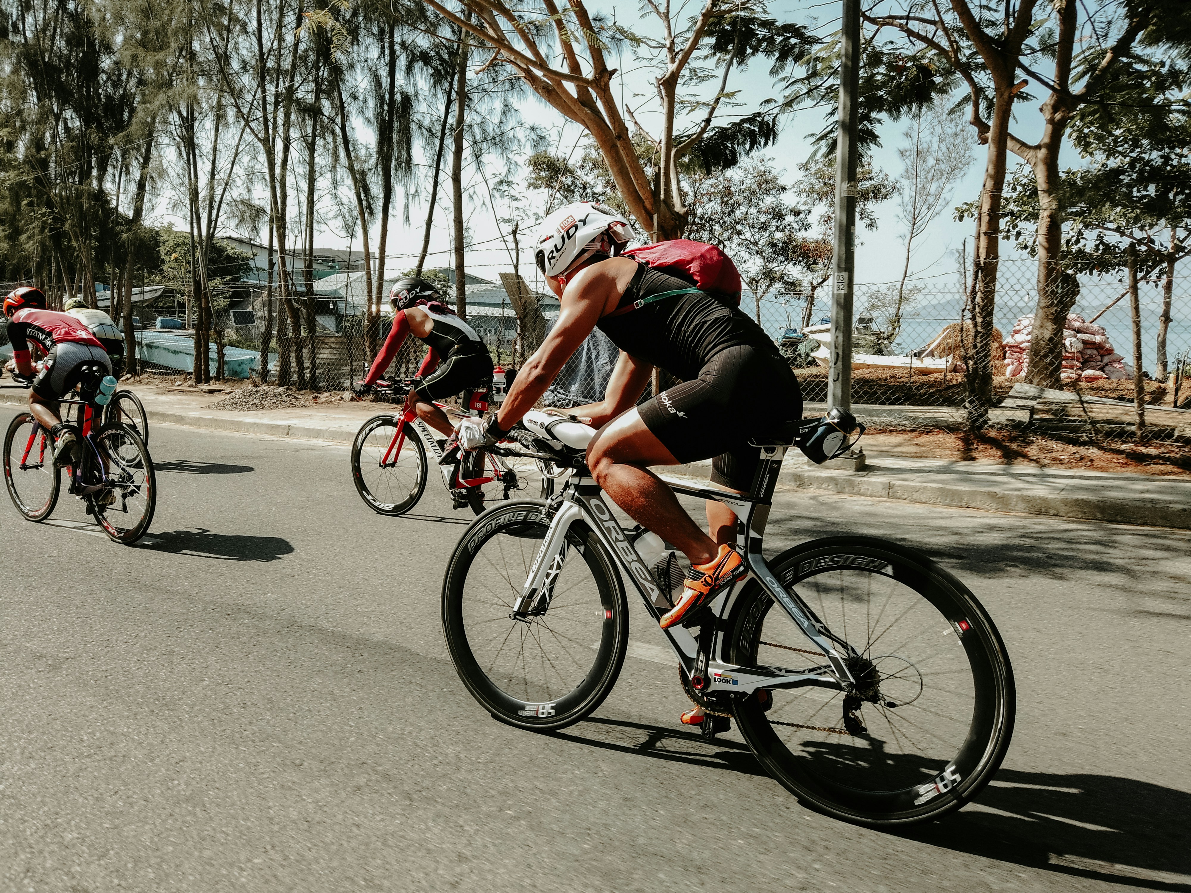 Cyclist riding a road bike outdoors in real conditions.