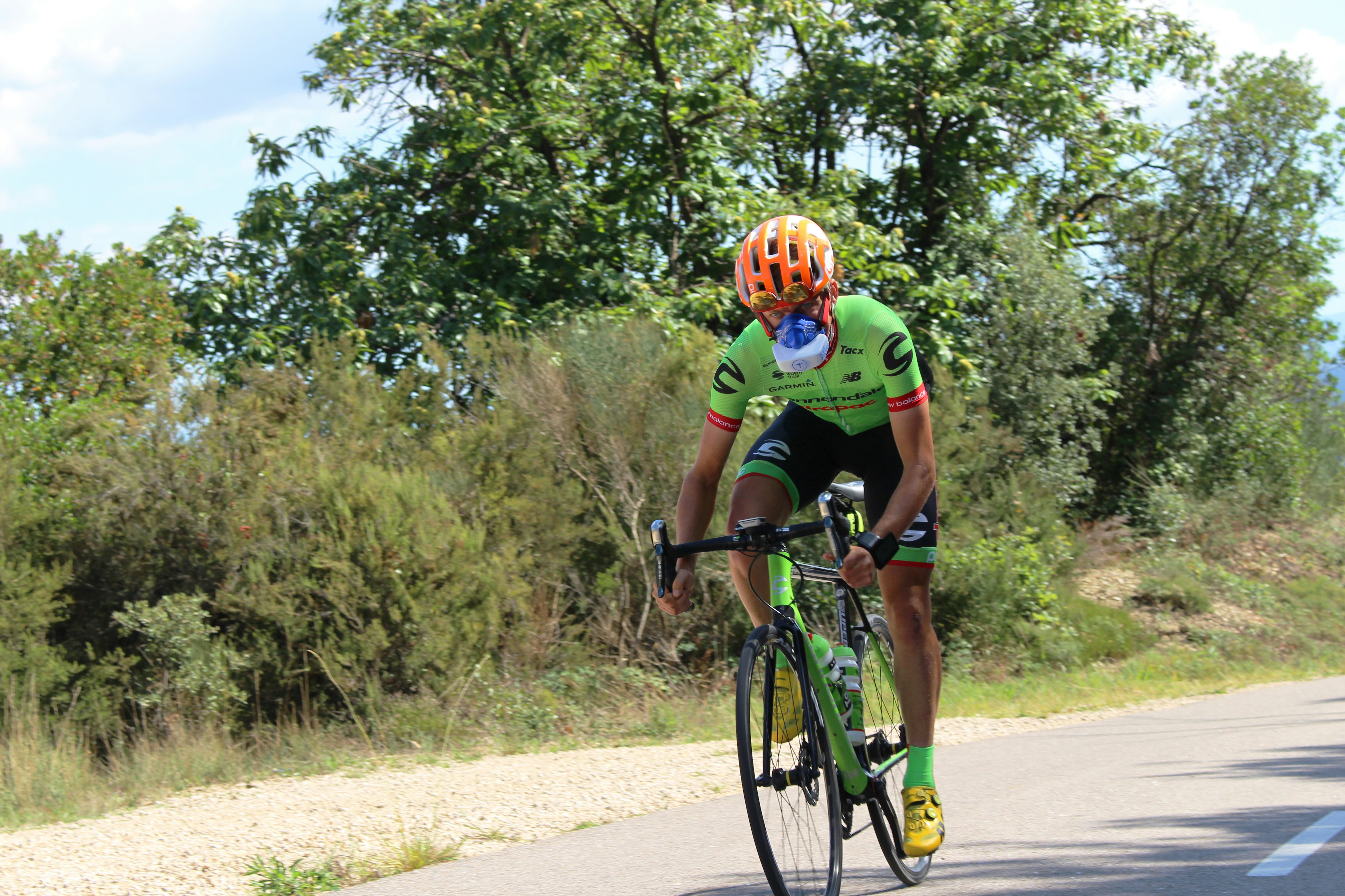 Cyclist riding a road bike outdoors in real conditions.