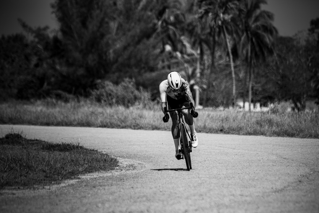 Group of road cyclists riding together outdoors on paved roads.