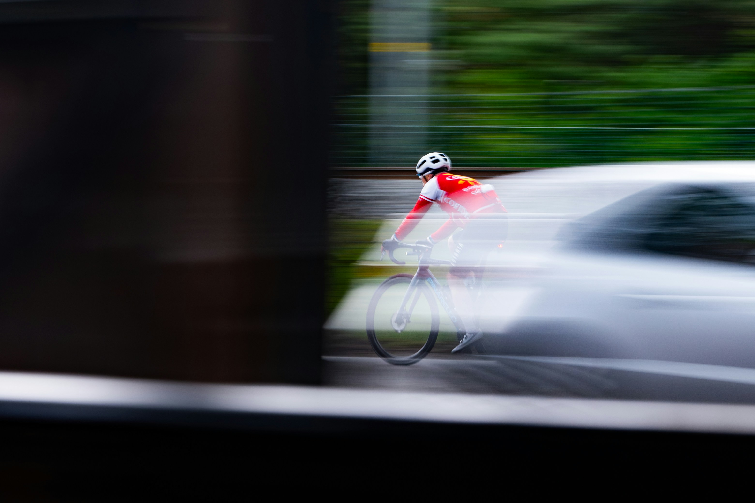 Cyclist riding a road bike outdoors in real conditions.